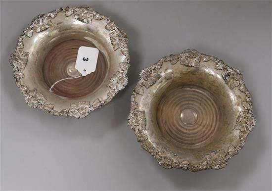 A pair of silver plated wine coasters, 20.3cm.